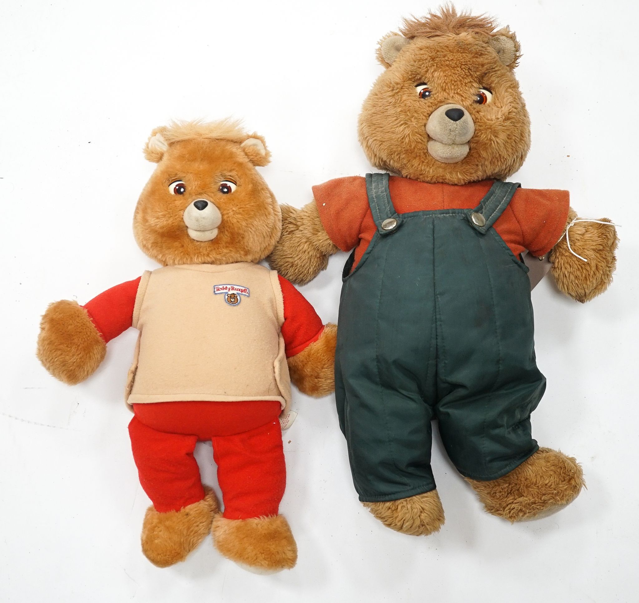 A Teddy Ruxpin 1950's, good condition, Musical Play Tapes Animatronic, has box, literature and tapes, together with another unboxed, no tapes